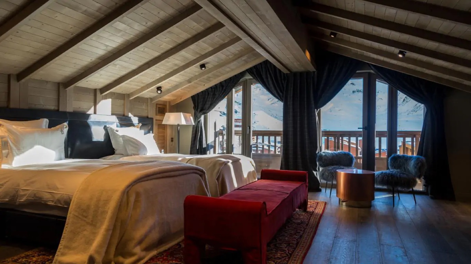 Bedroom under the eaves with mountain-facing balcony