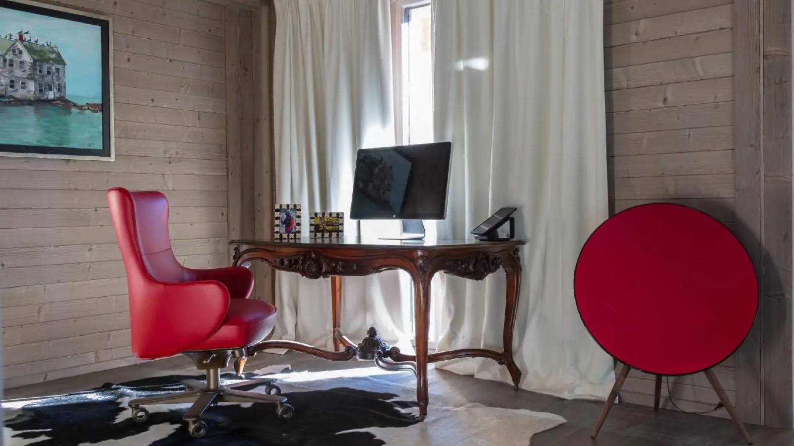 Study corner with carved desk and red chair