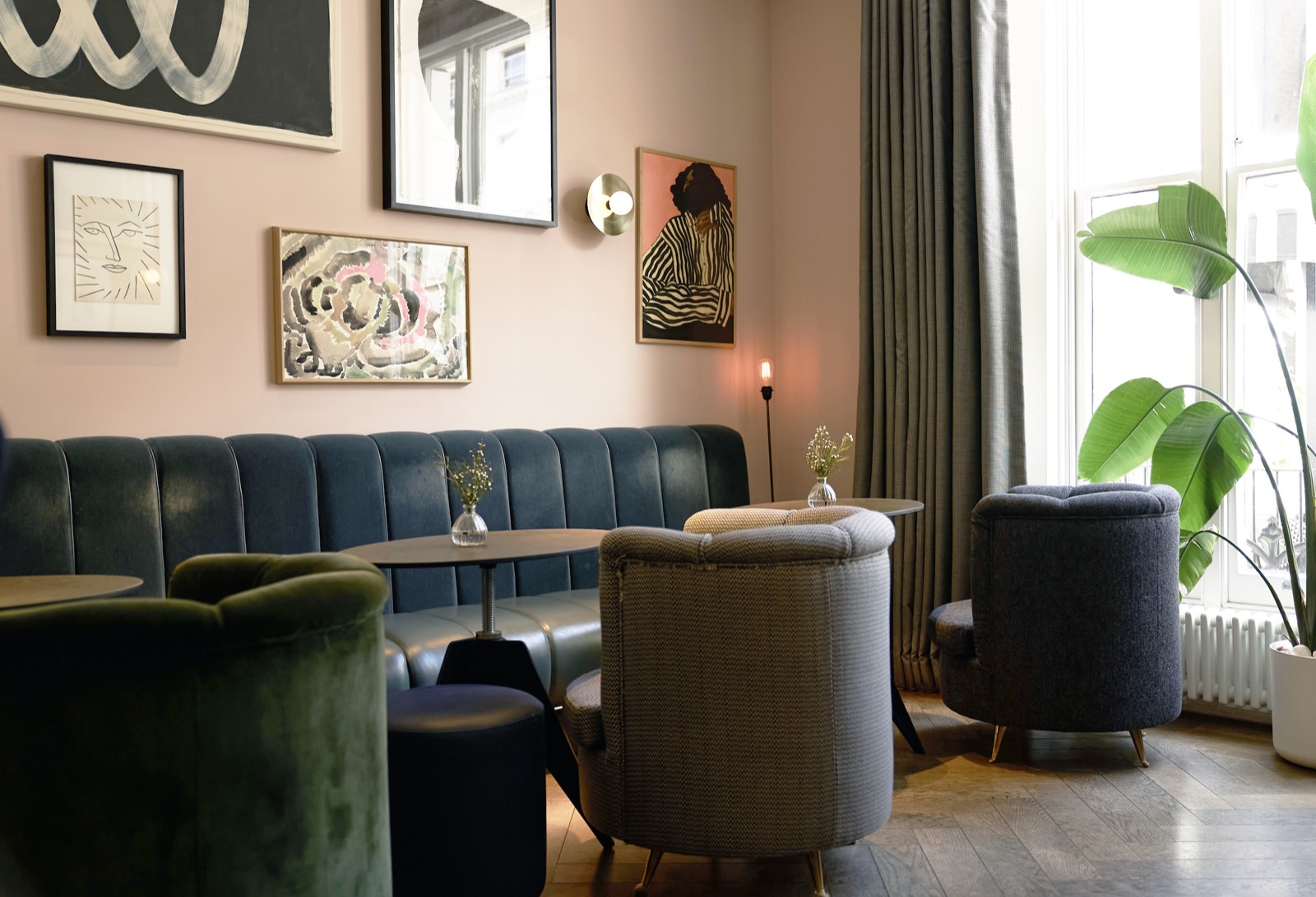 Residents' lounge with pink walls and art