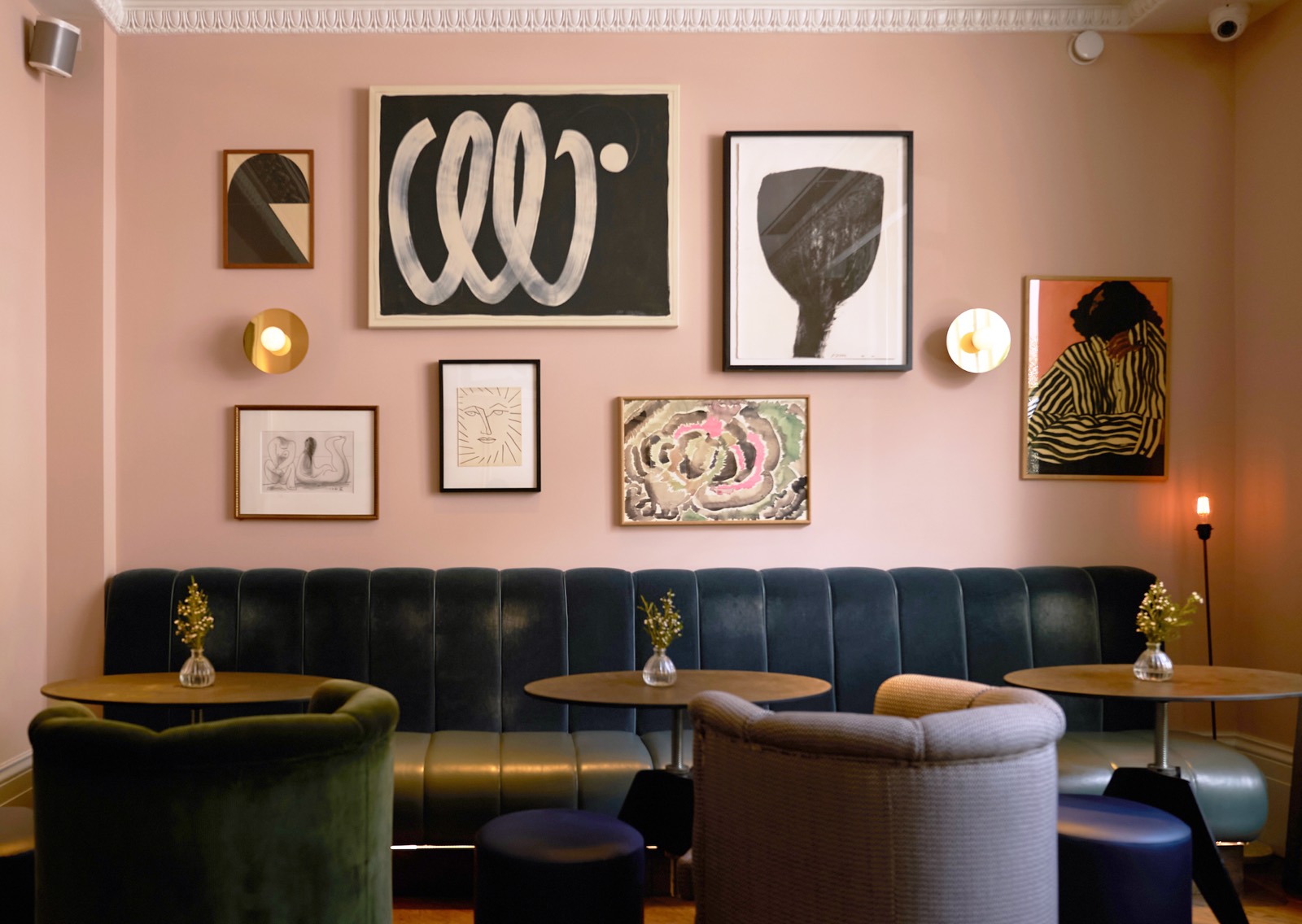 Residents' lounge with pink walls and banquette