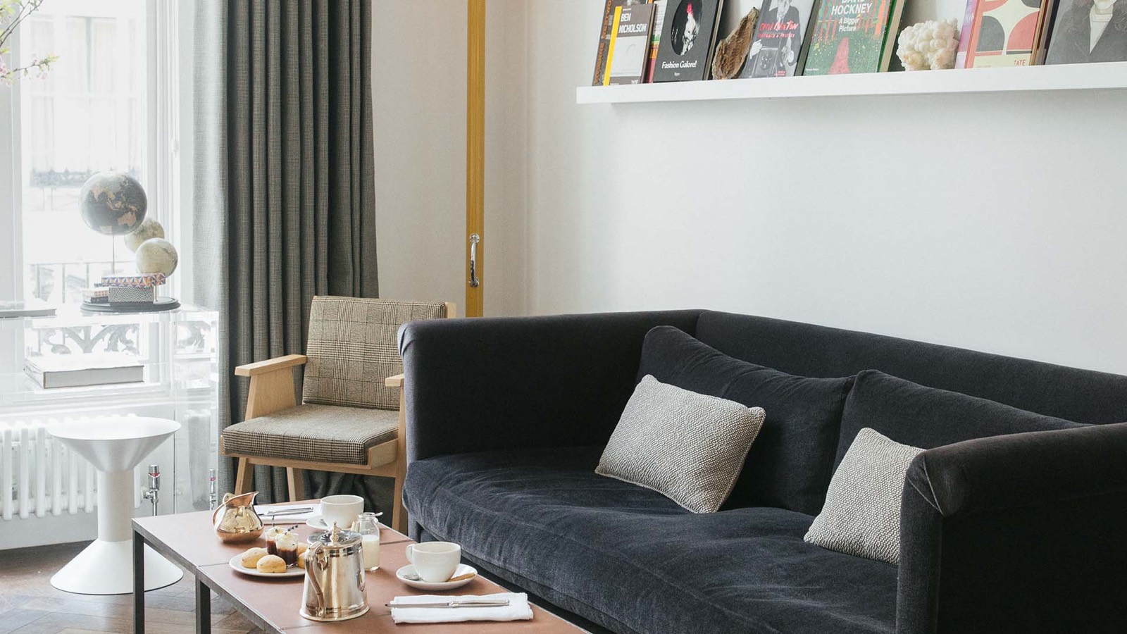 Sitting room with breakfast tray and art books