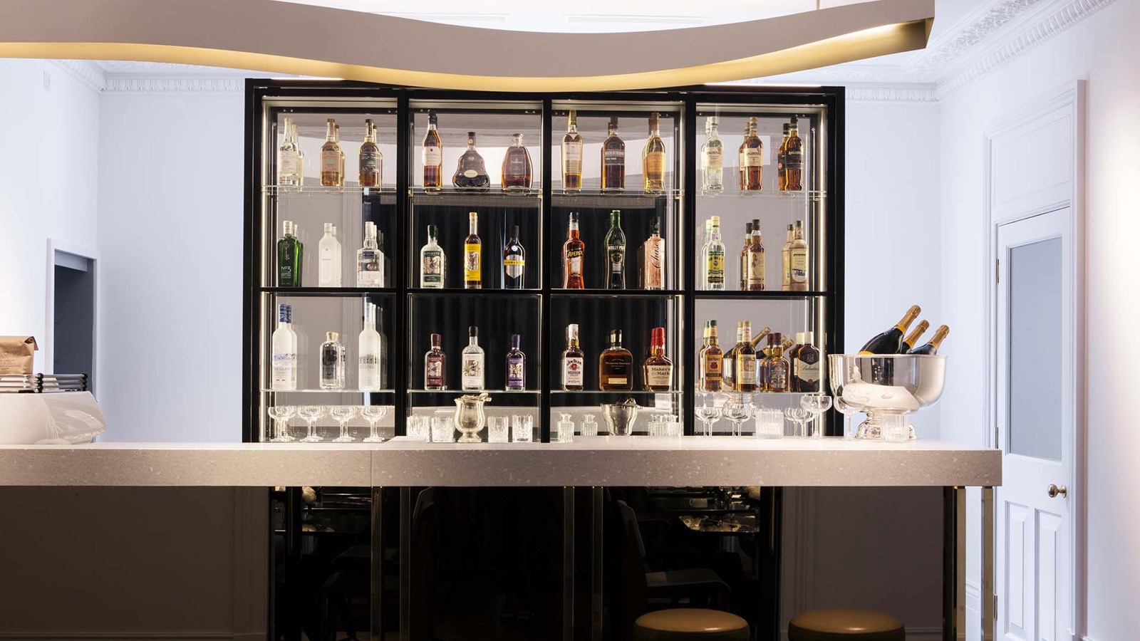 The bar with backlit bottle shelves