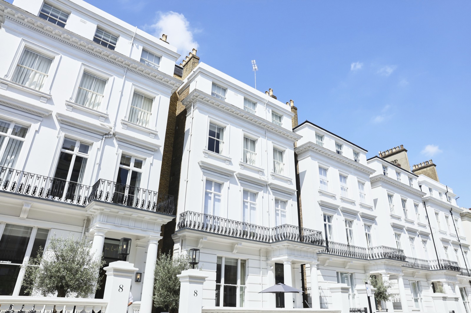The white stucco townhouses from the street