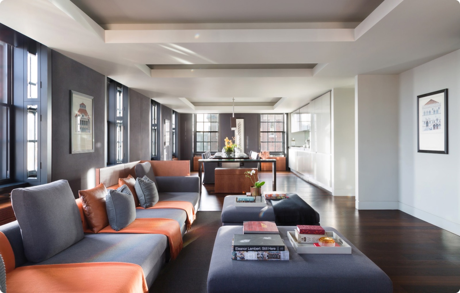 Living room with tall windows down one side