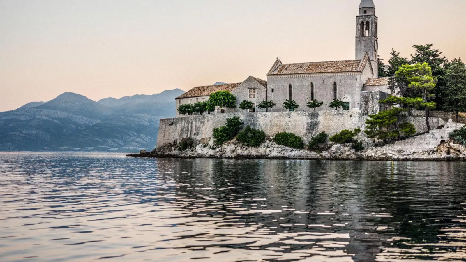 The house seen from the water at dusk