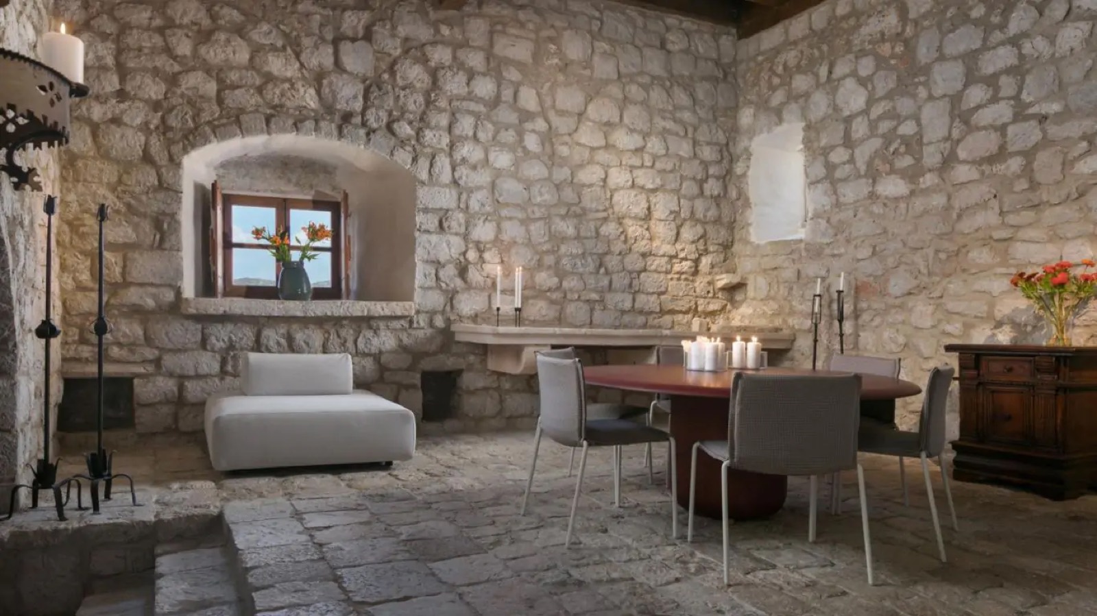 Candlelit round table on the old stone floor