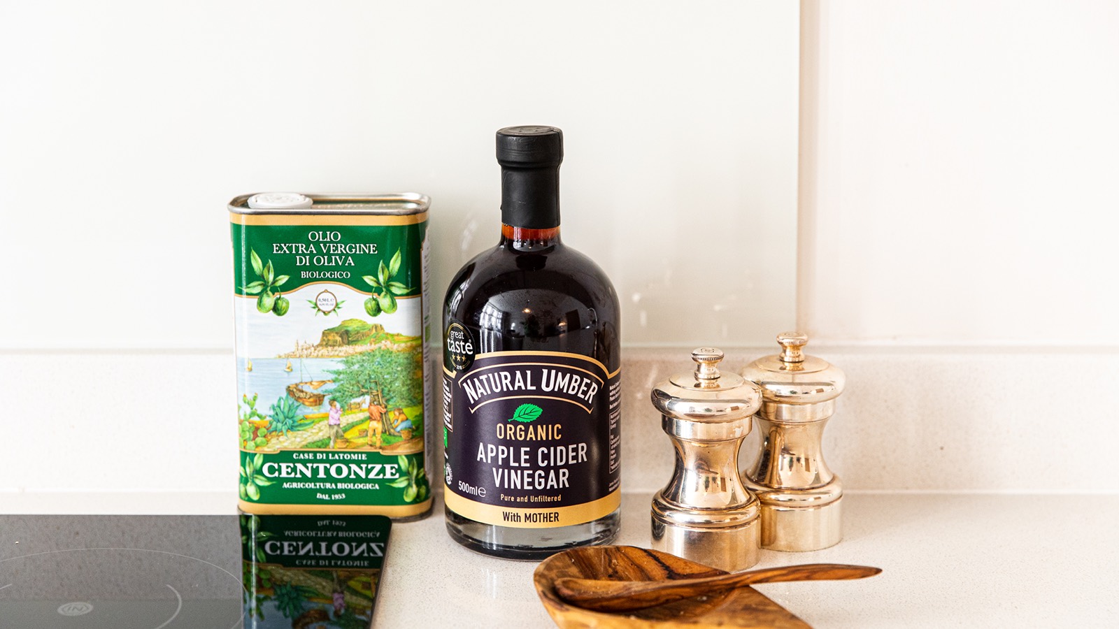 Olive oil and pepper mills on the worktop