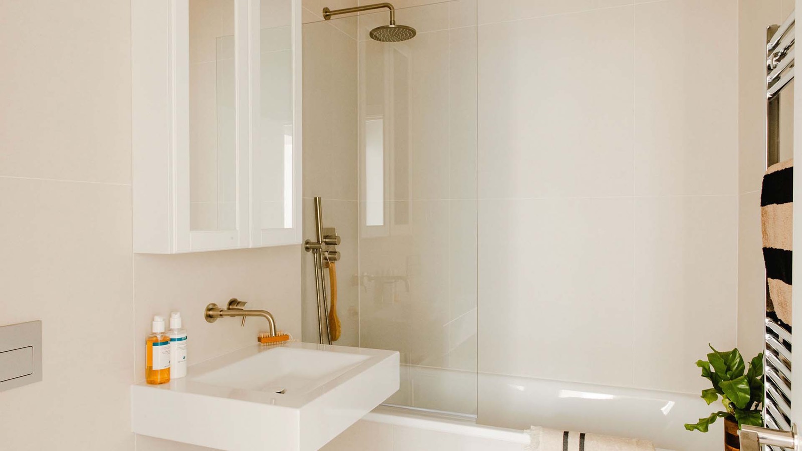 Bathroom with rain shower over the bath