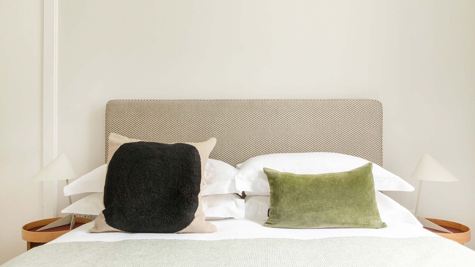 Second bedroom with woven oatmeal headboard