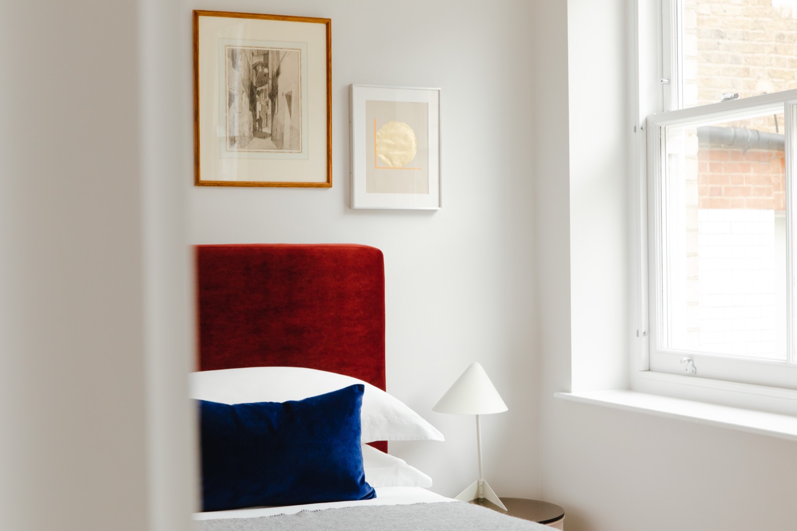 Bedroom corner beside the sash window
