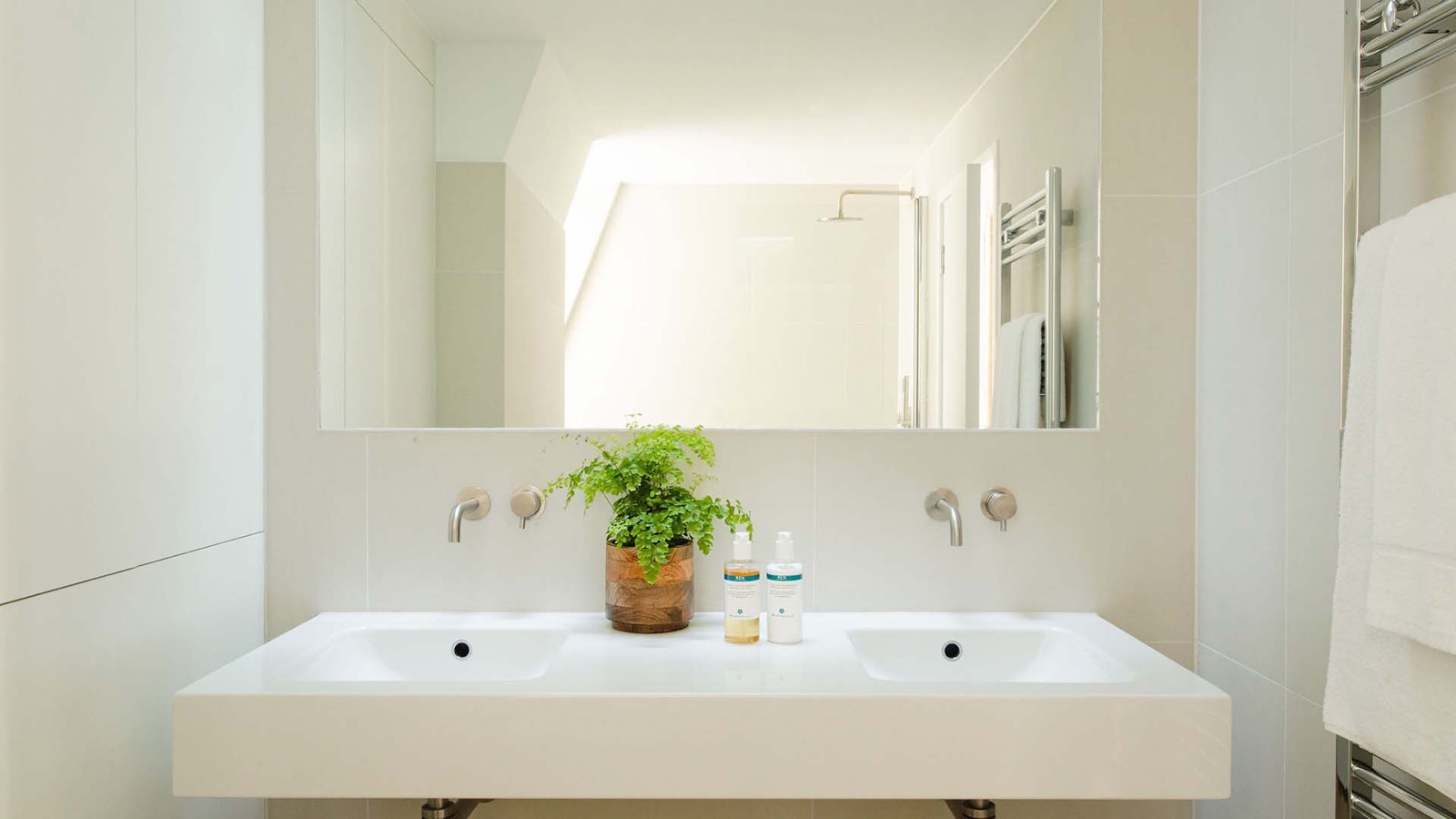 Bathroom with twin basins and rain shower