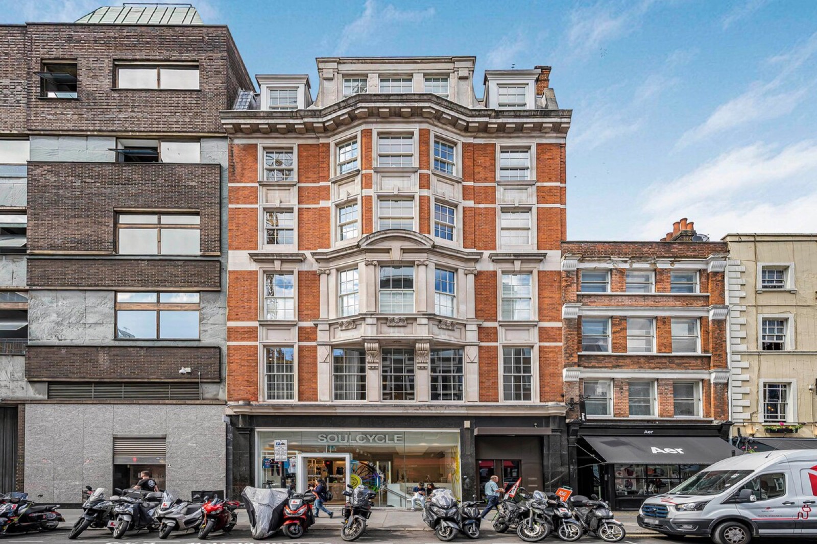 Red-brick facade with its bay windows