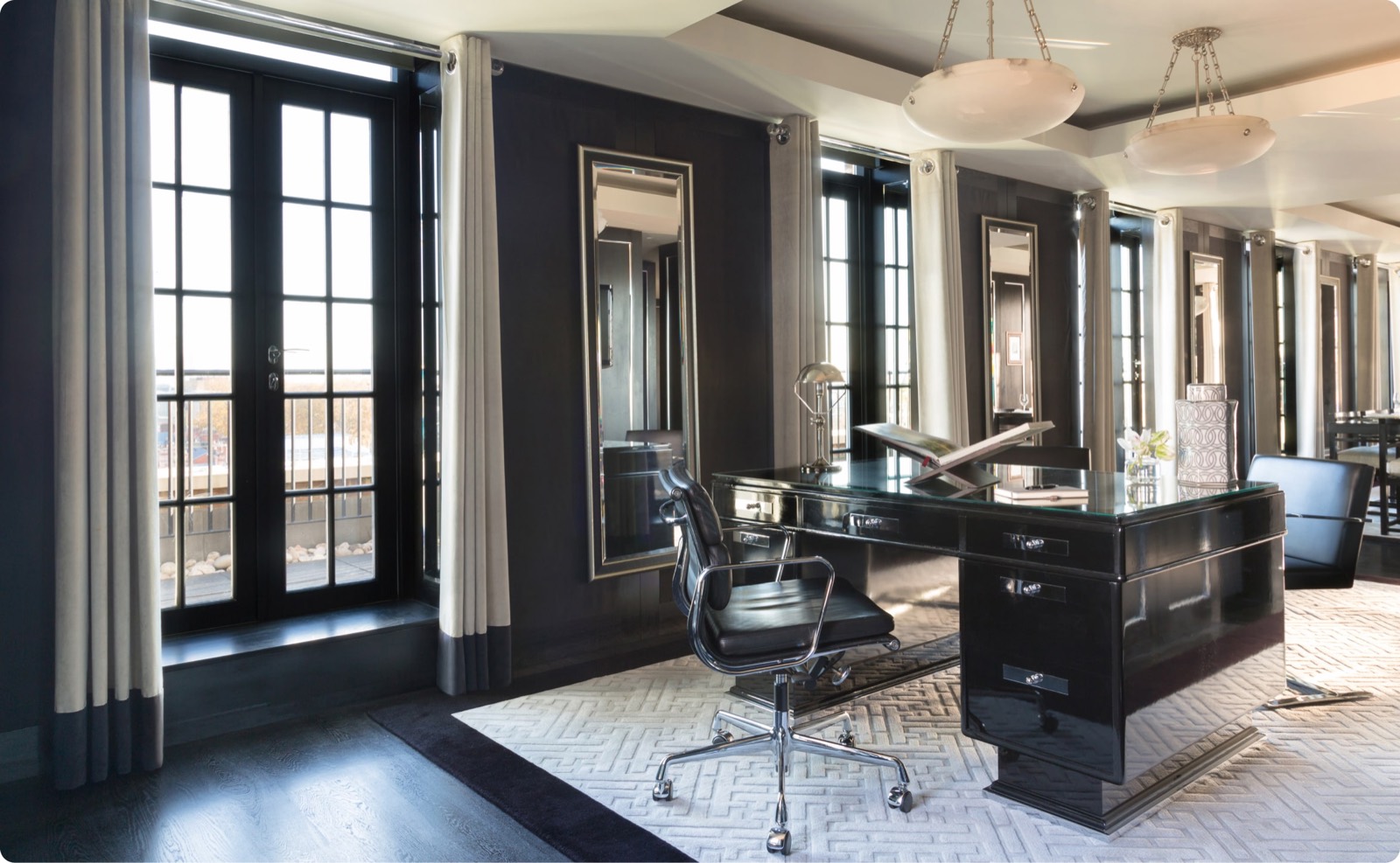Study with lacquered desk beside the balcony doors