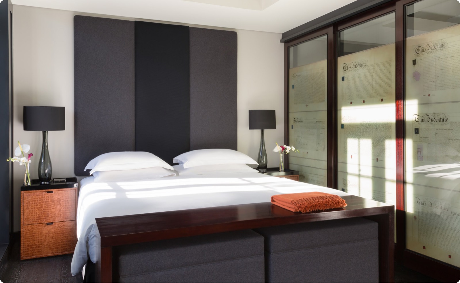 Bedroom with padded headboard and glazed screens