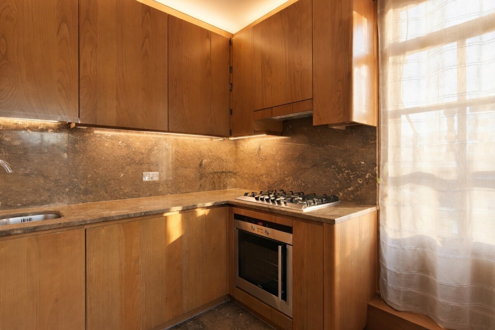 Kitchen with marble worktop and gas hob