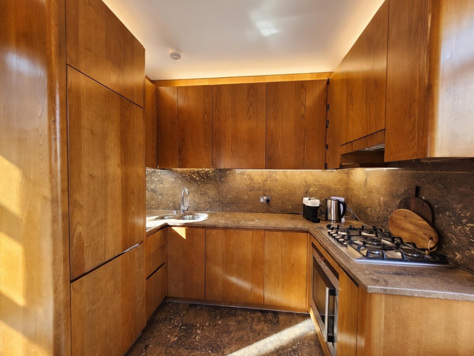 Cherry wood kitchen with integrated appliances