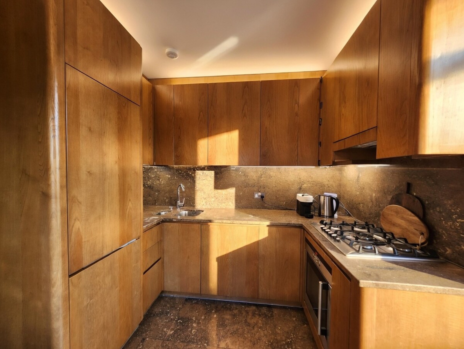 Sink and hob under the wood cabinetry