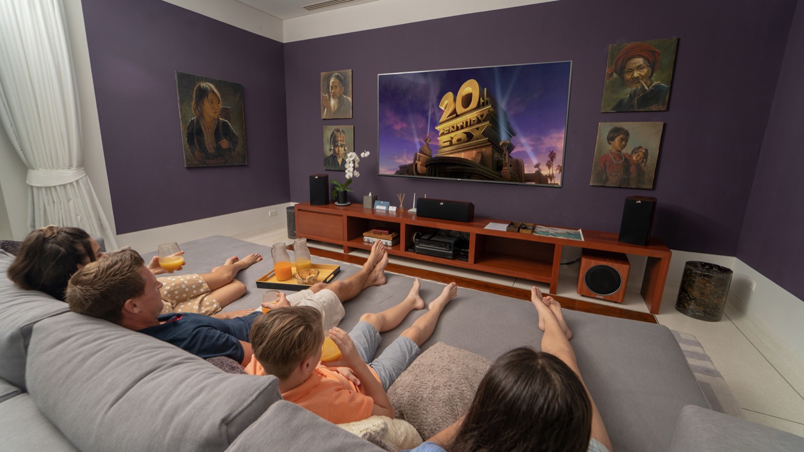 Media room with cinema screen and sofas