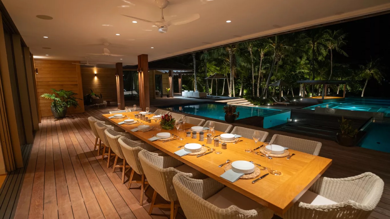 Terrace dining table set beside the pool