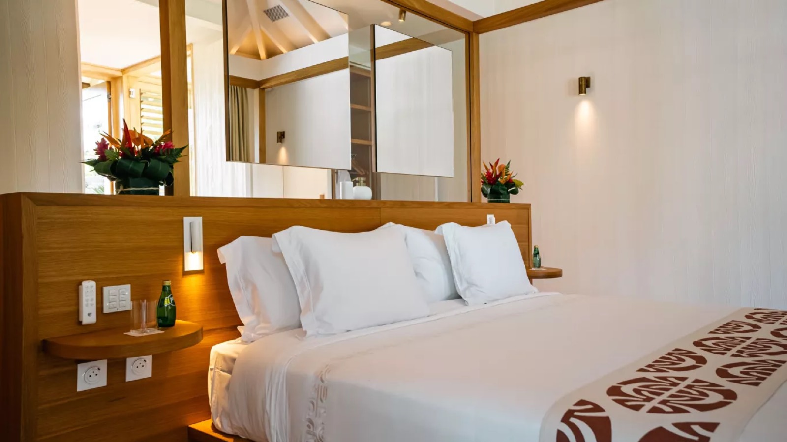 Bed dressed with a tapa-print runner