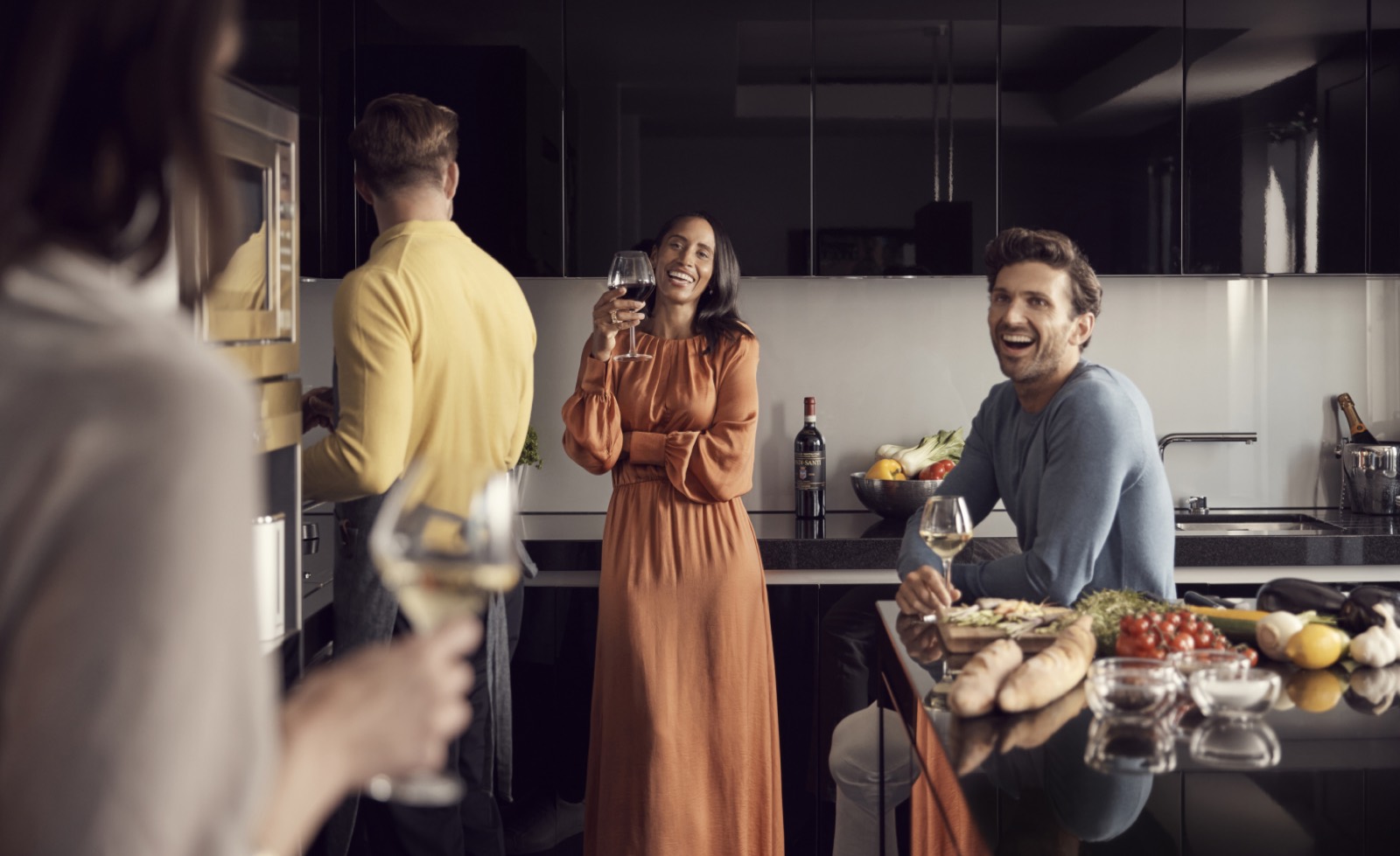Guests gathered in the kitchen
