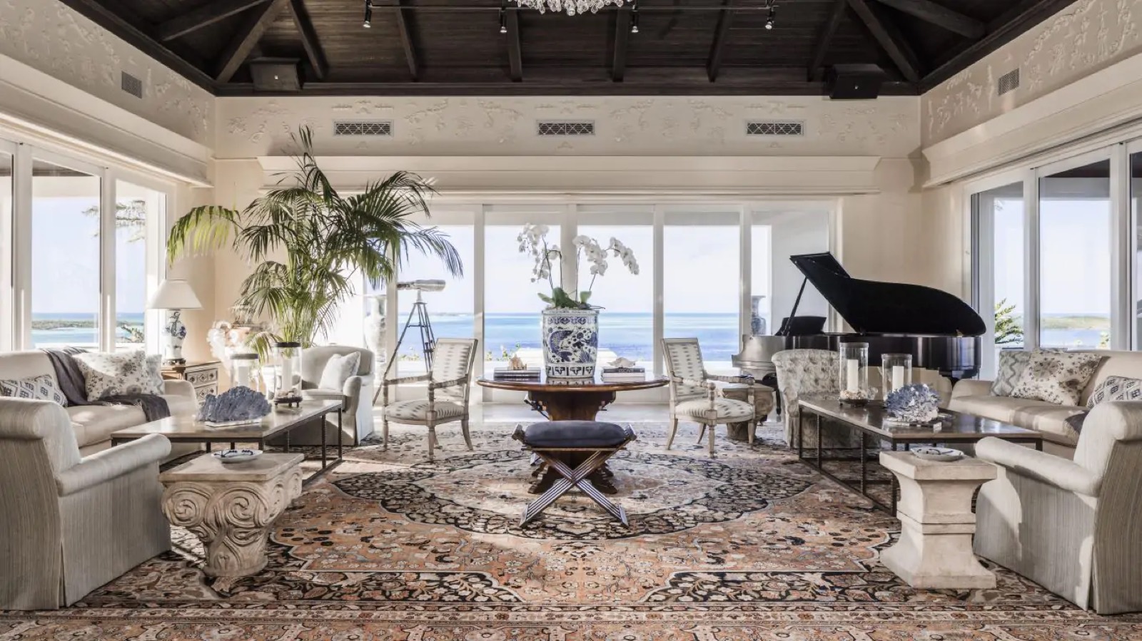 Drawing room with grand piano and sea views