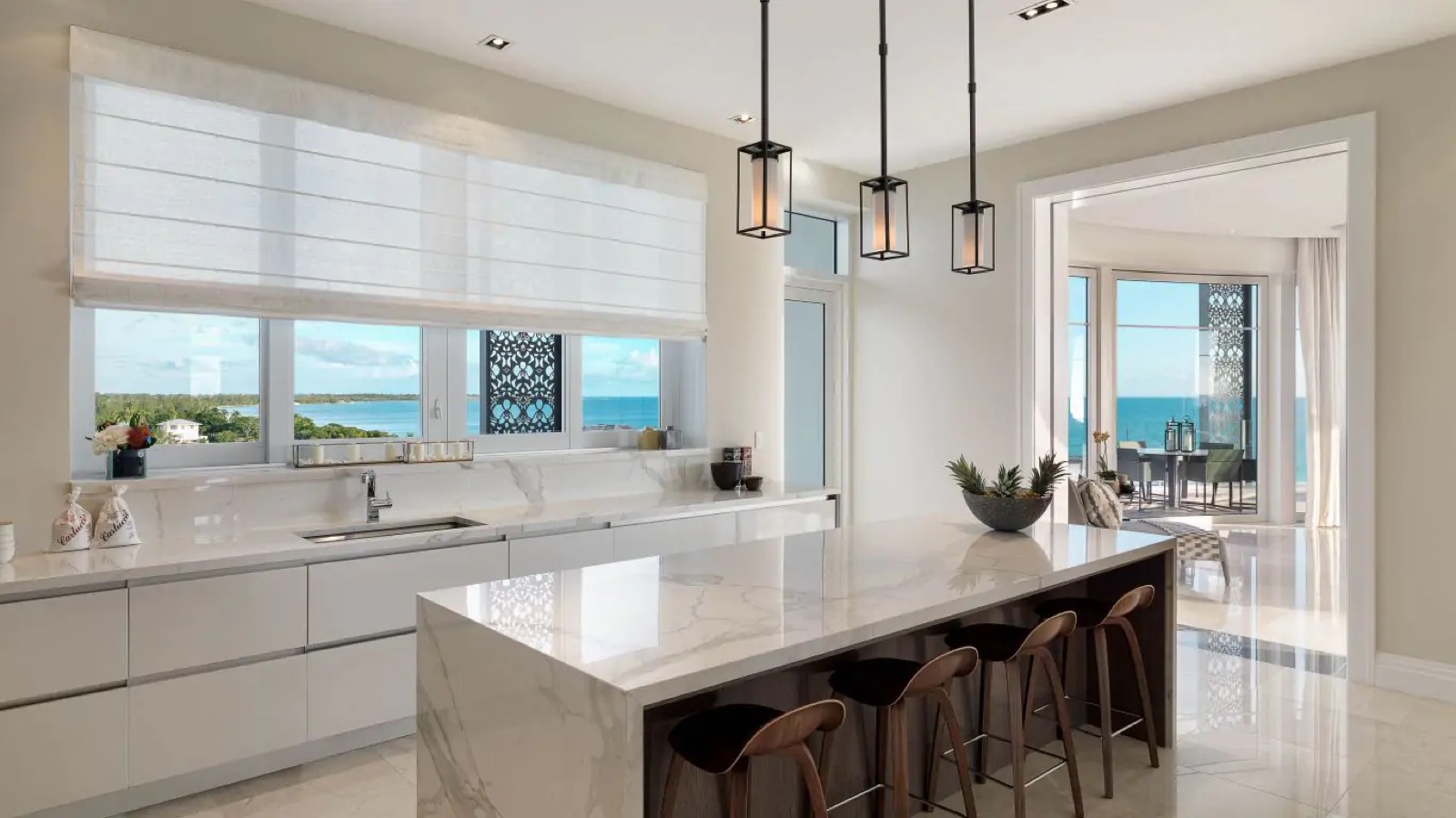 Marble island kitchen with breakfast stools