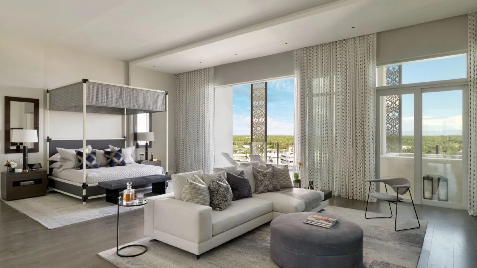 Principal bedroom with canopy bed and sitting area