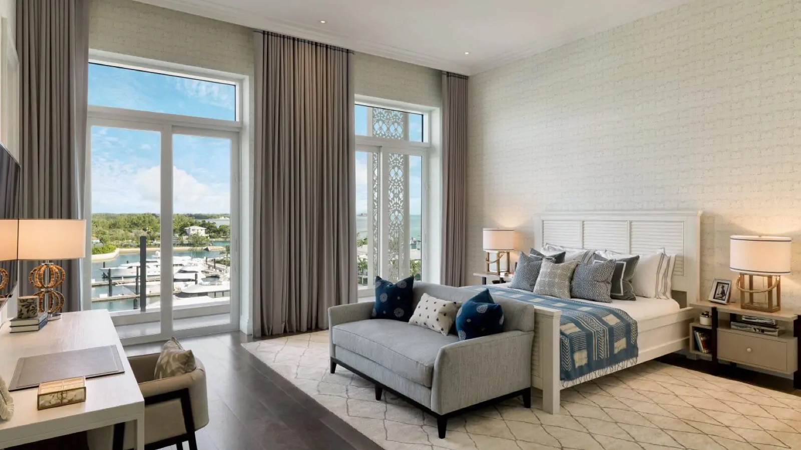 Guest bedroom in blue overlooking the marina