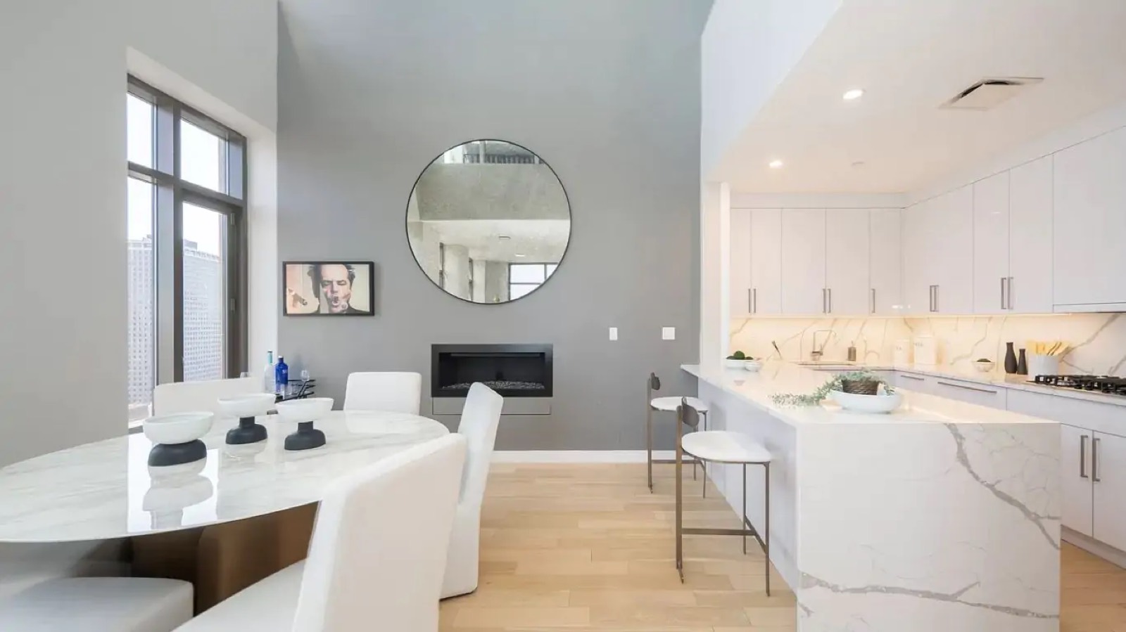 Marble dining table and kitchen bar by the fireplace