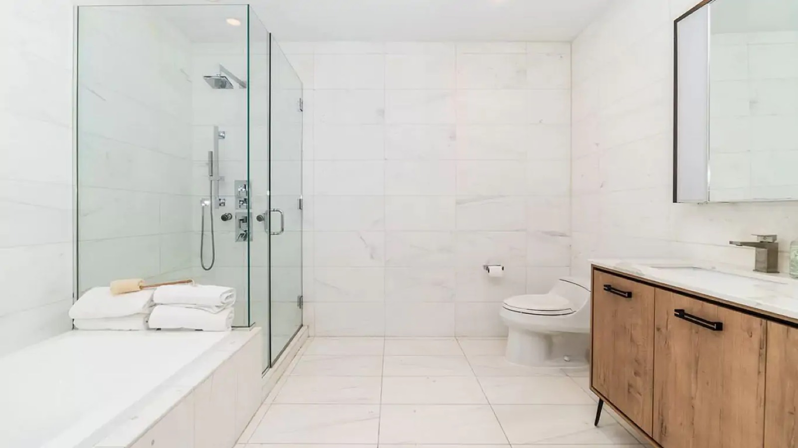Marble bathroom with glass walk-in shower
