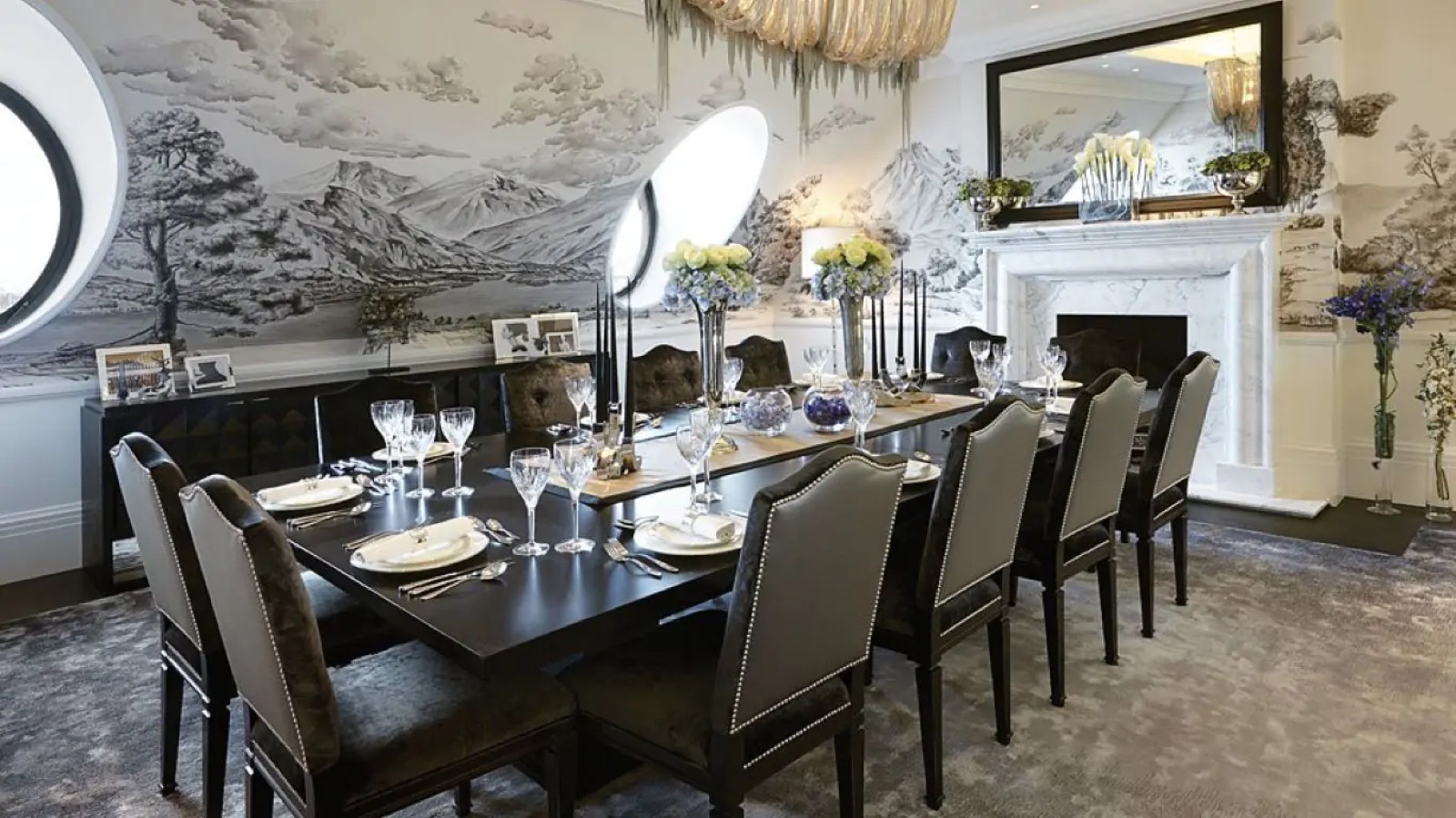 Dining room with painted mural and marble fireplace