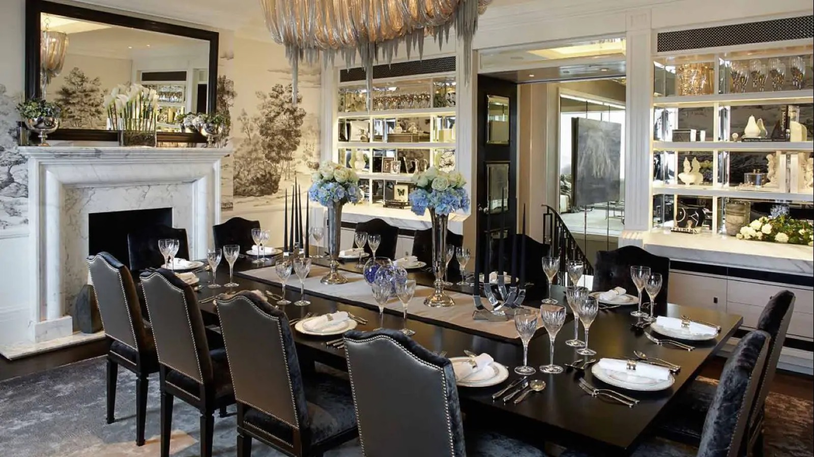 Dining table set beneath the glass chandelier