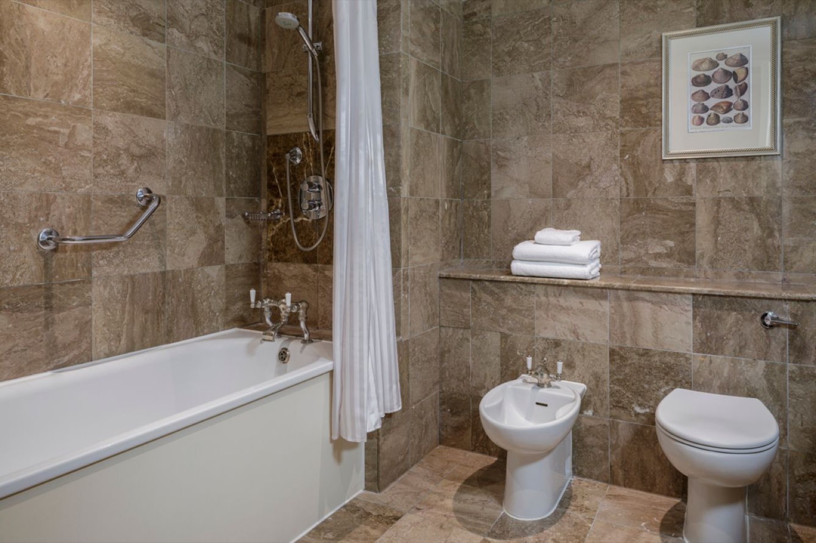 Marble bathroom with bath and shower