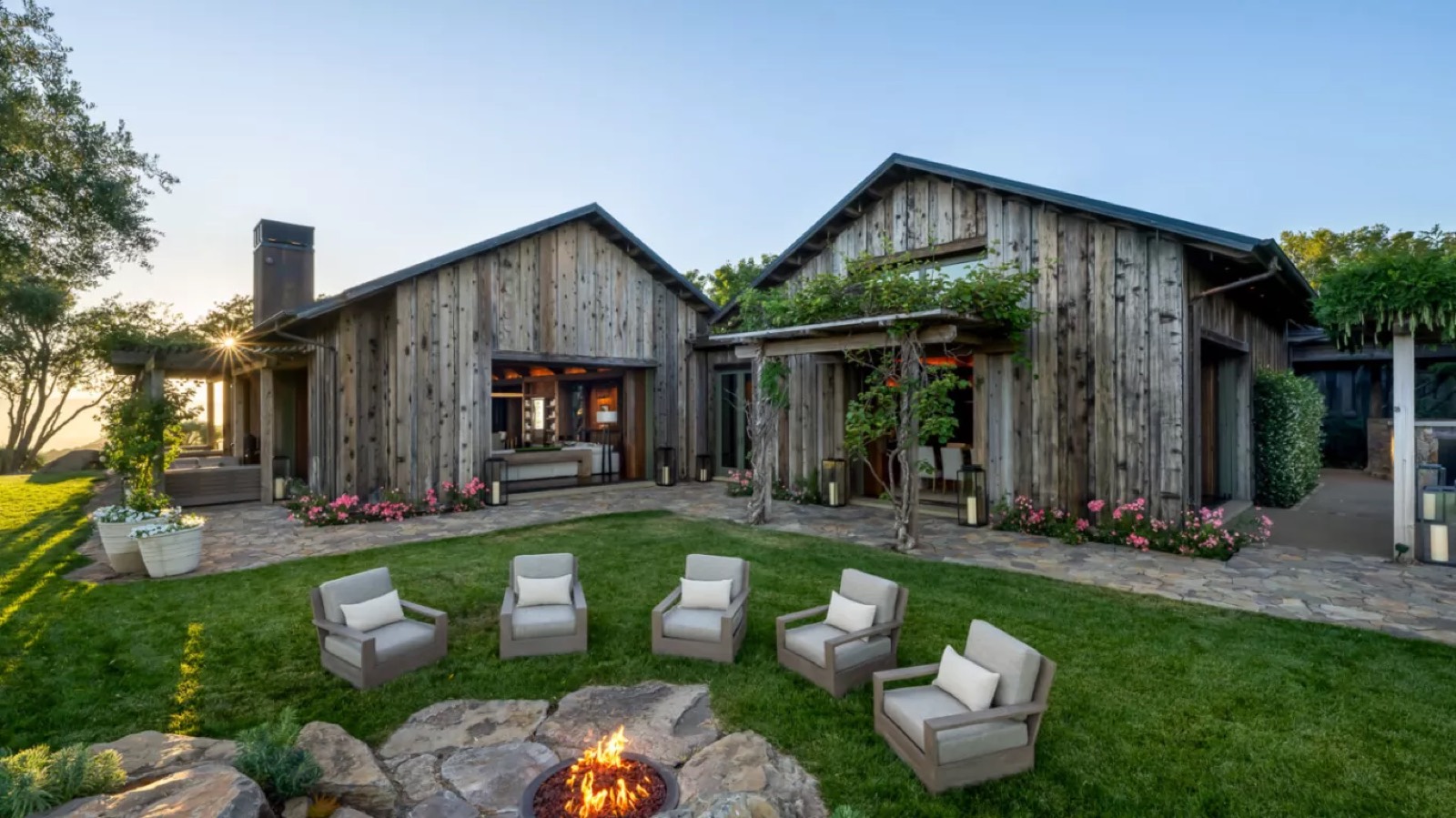 Fire pit on the lawn below the house