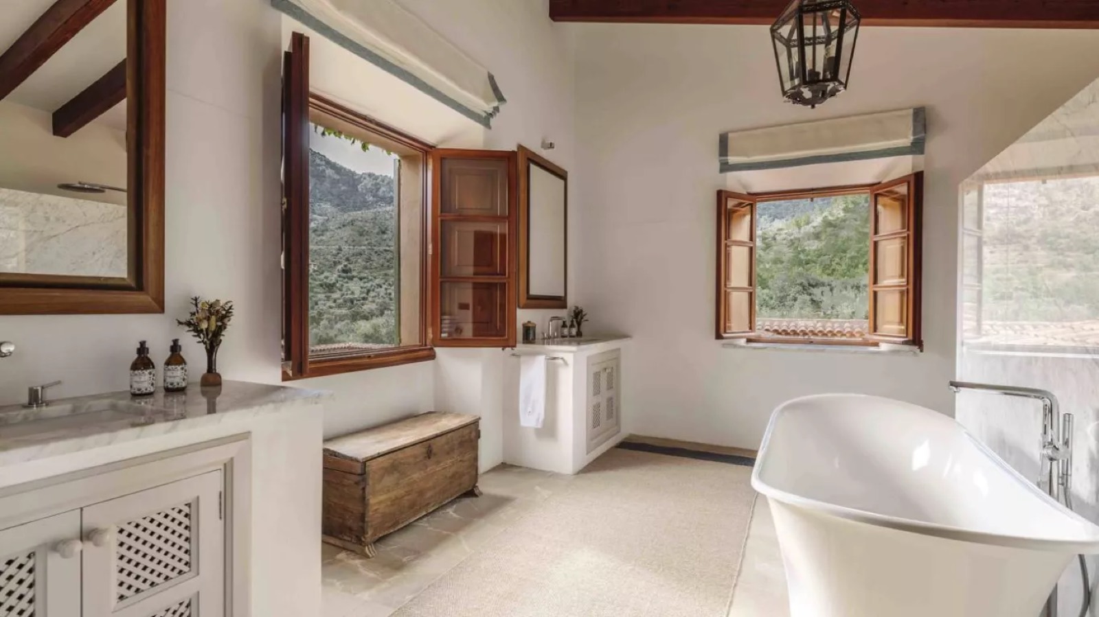 Bathroom with roll-top bath and hillside windows