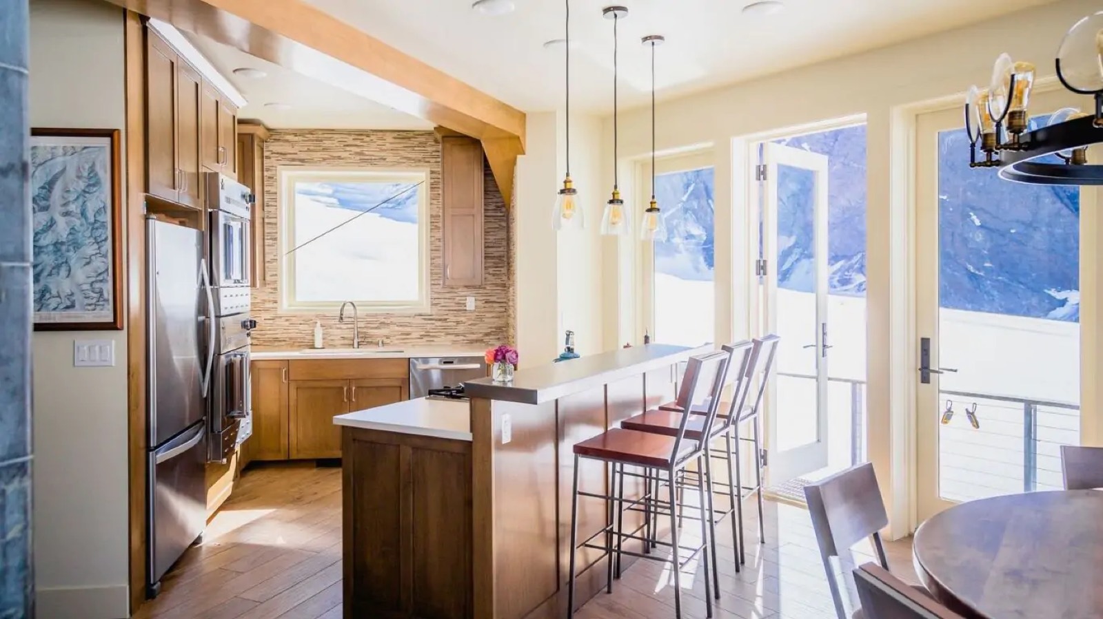 Kitchen with breakfast bar and deck doors