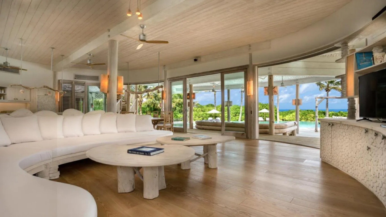 Living room with curved sofa and sliding doors