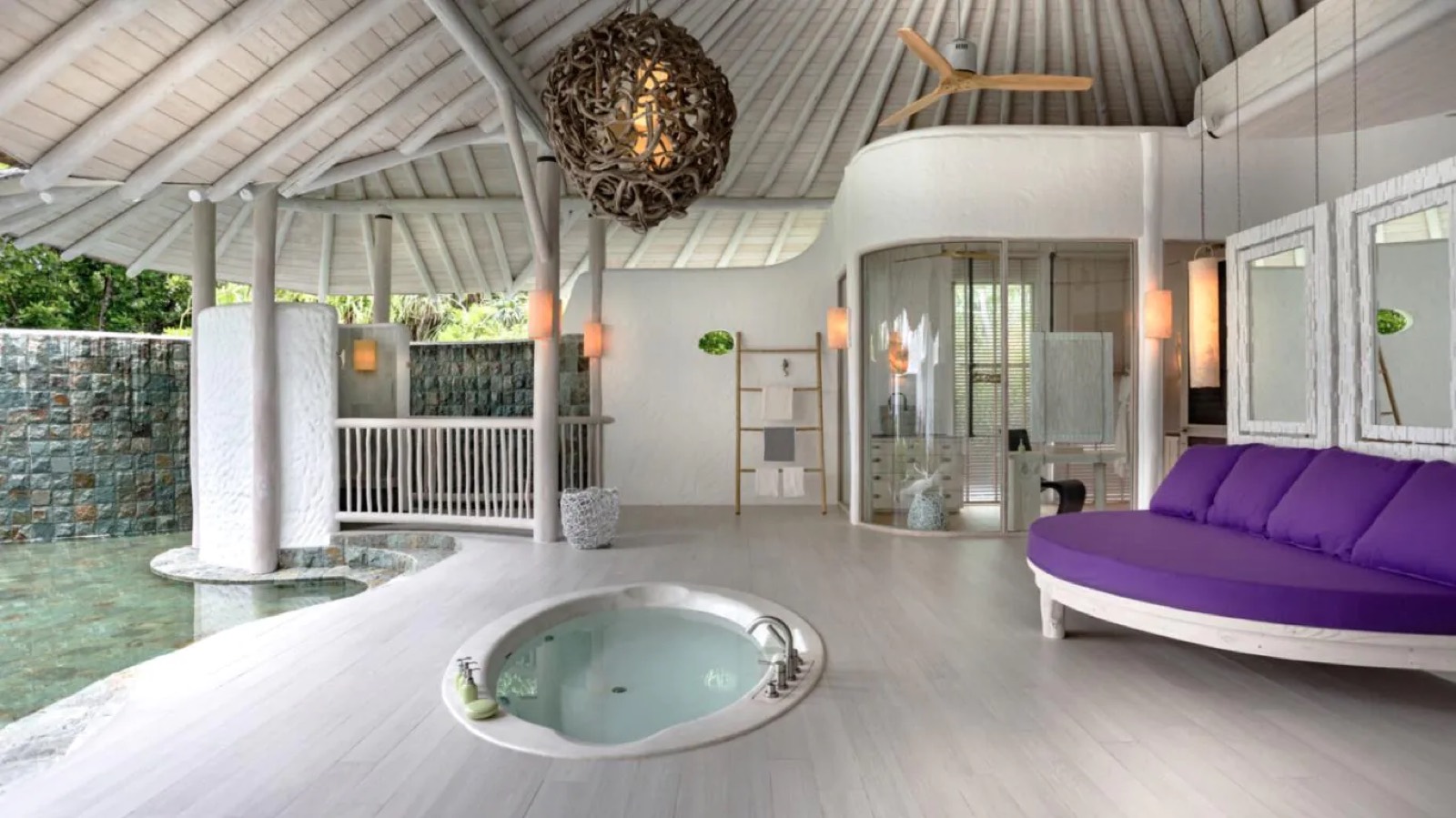 Open bathroom with sunken round bath
