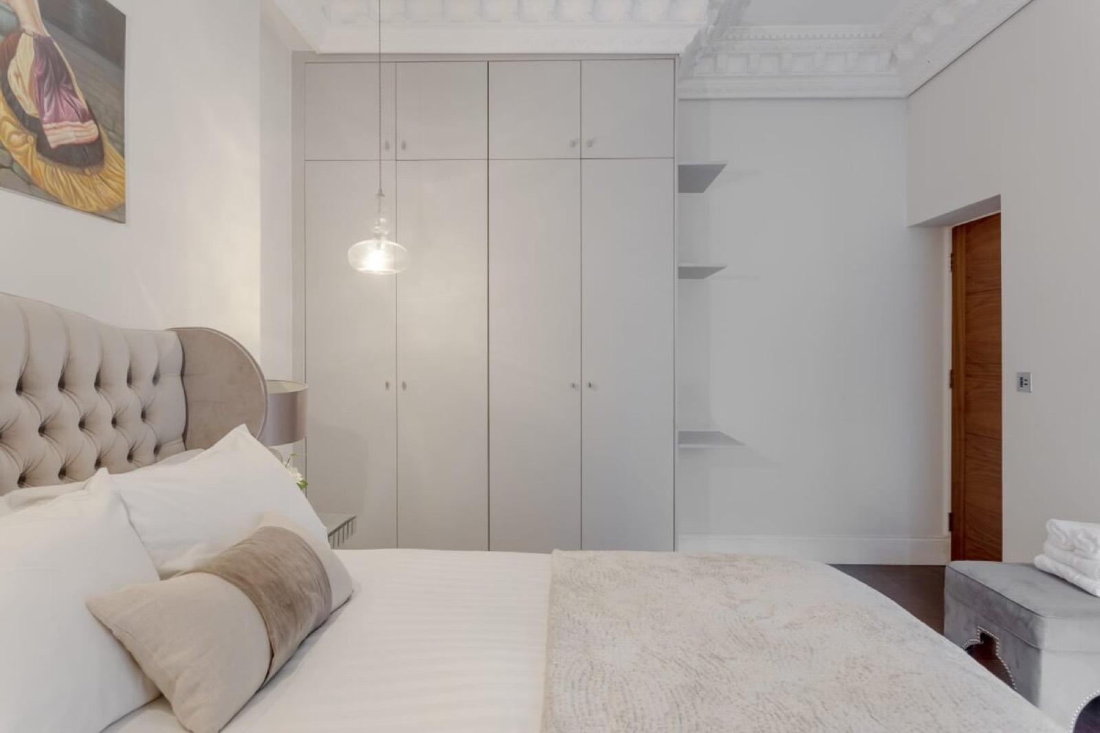 Bedroom with full-height fitted wardrobes