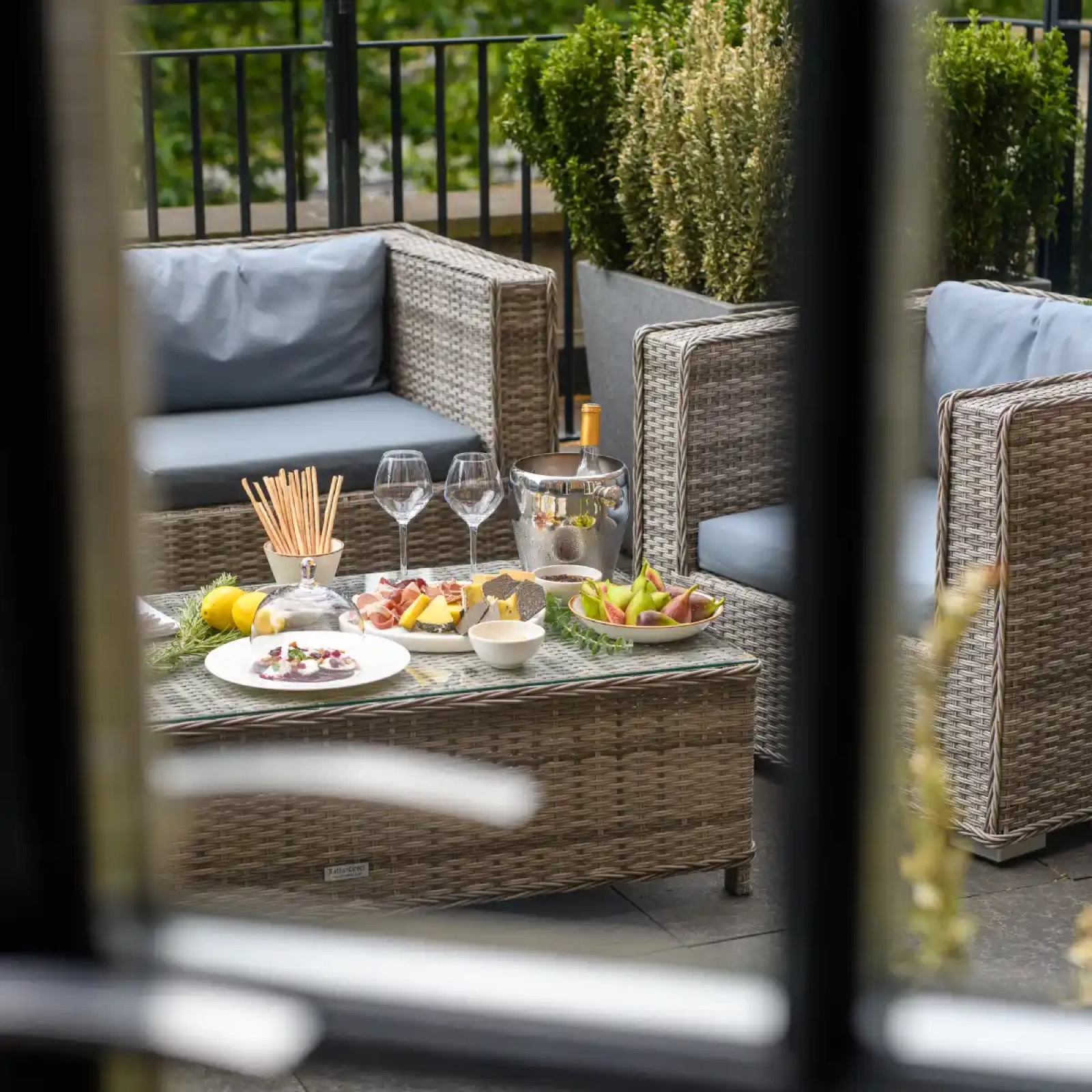 Rattan seating on the planted terrace
