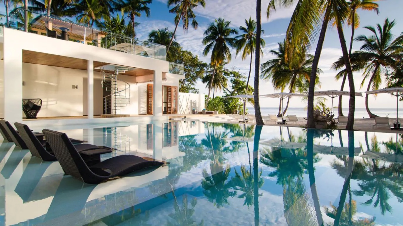 Loungers along the edge of the pool