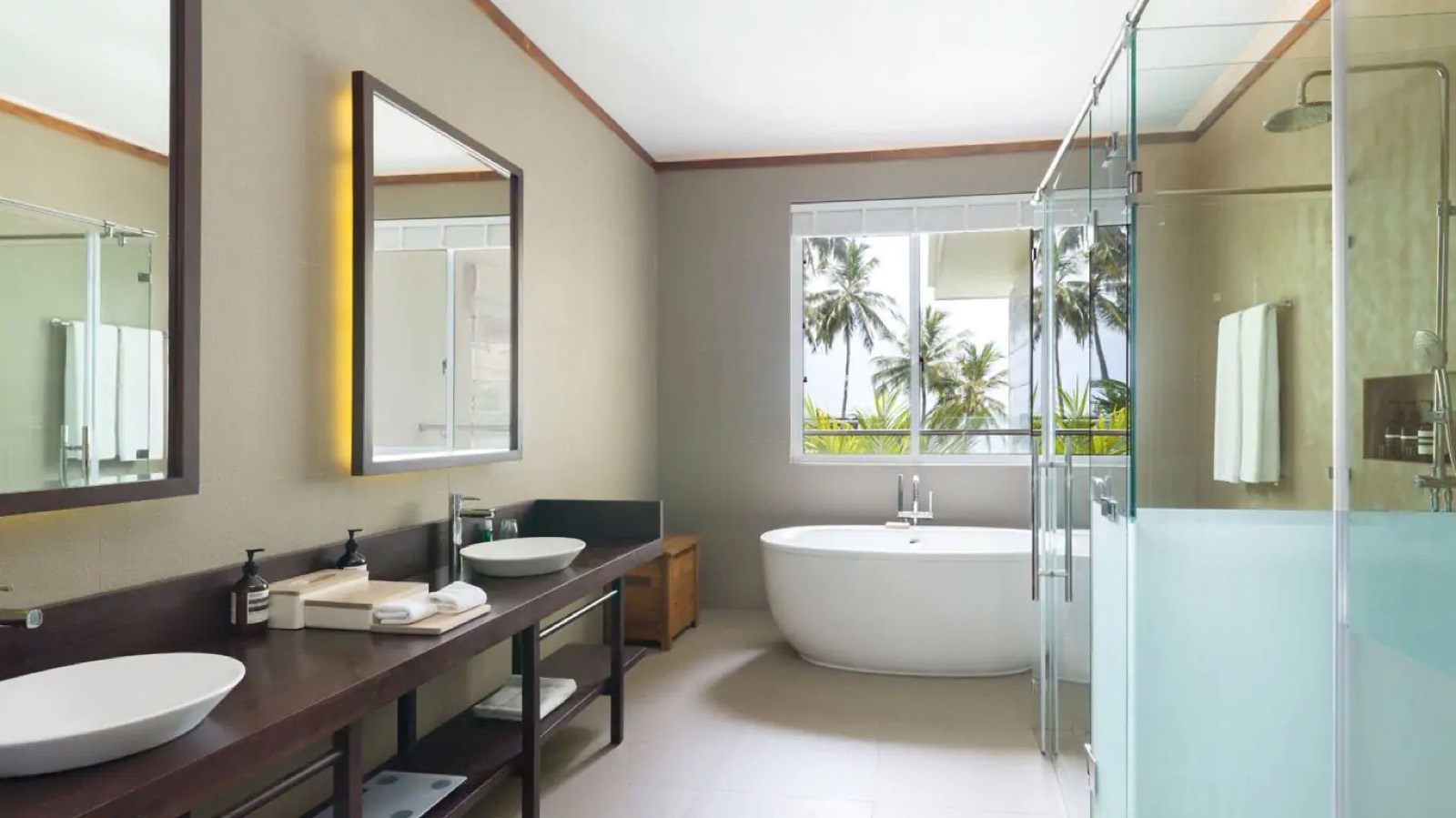 Bathroom with freestanding tub and twin basins