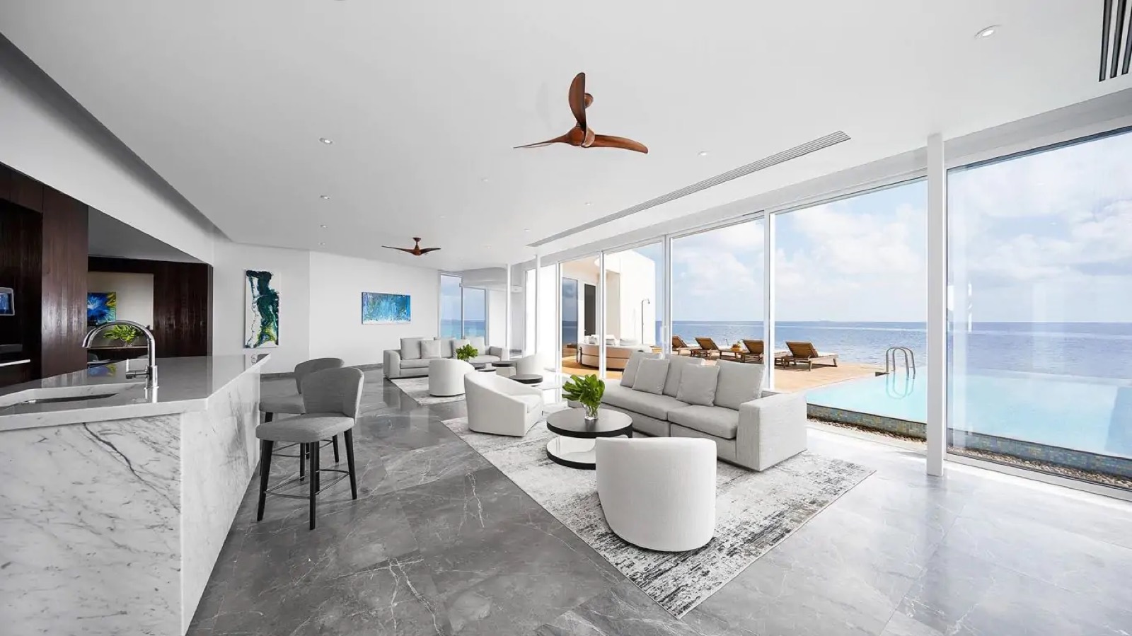 Living room with marble bar and pool beyond
