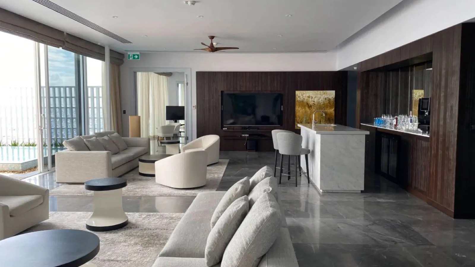 Lounge with wet bar and timber panelling
