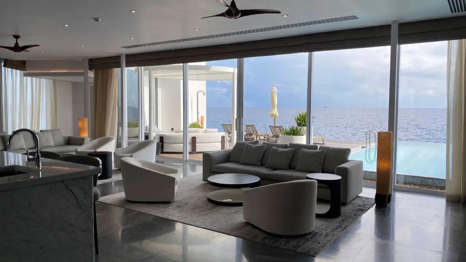 Living room at dusk facing the ocean