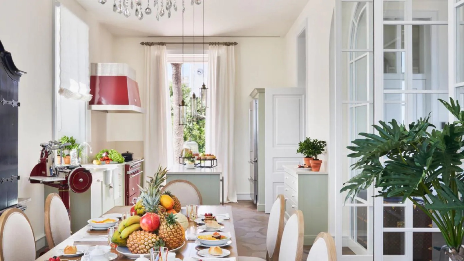 Dining table laid beside the red range