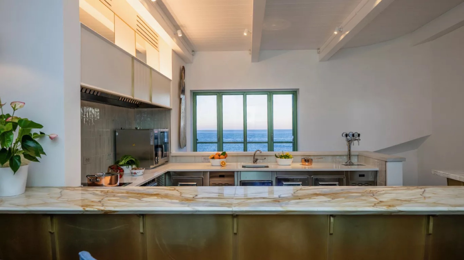 Kitchen with marble breakfast counter and sea view