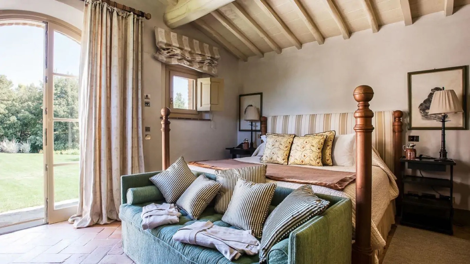 Bedroom with arched doors onto the lawn