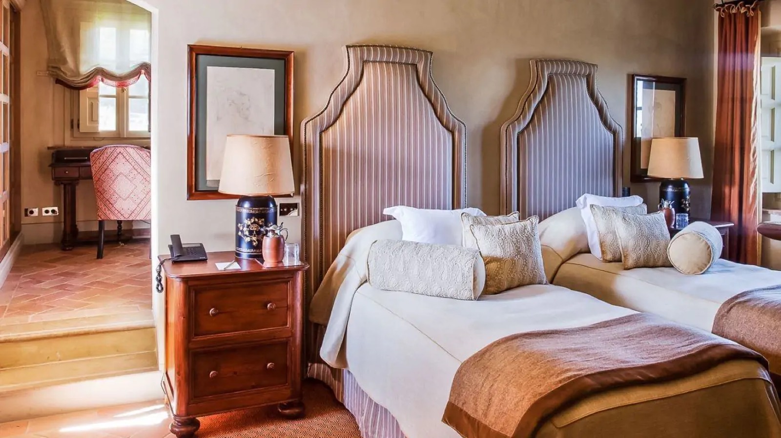 Twin bedroom with tall striped headboards